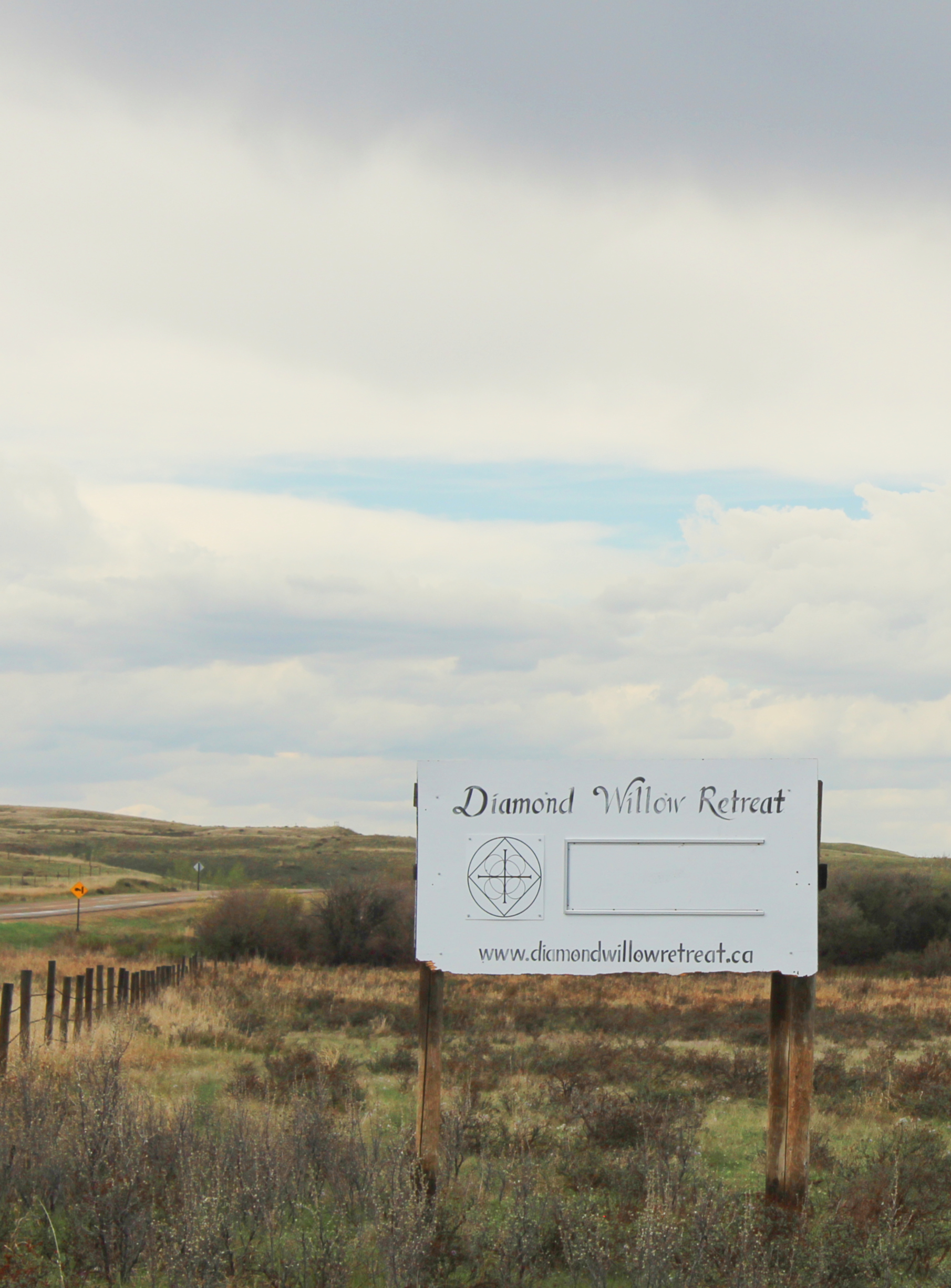 Signboard by access road Signboard by access road